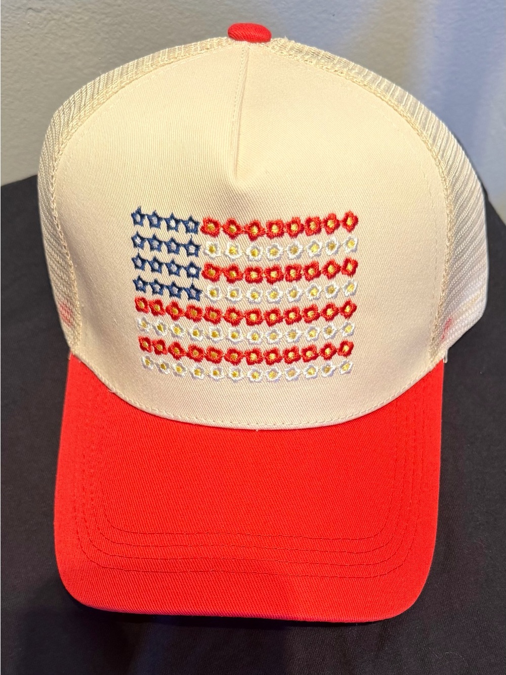 Cream and Red Trucker Hat with Embroidered Flag Design